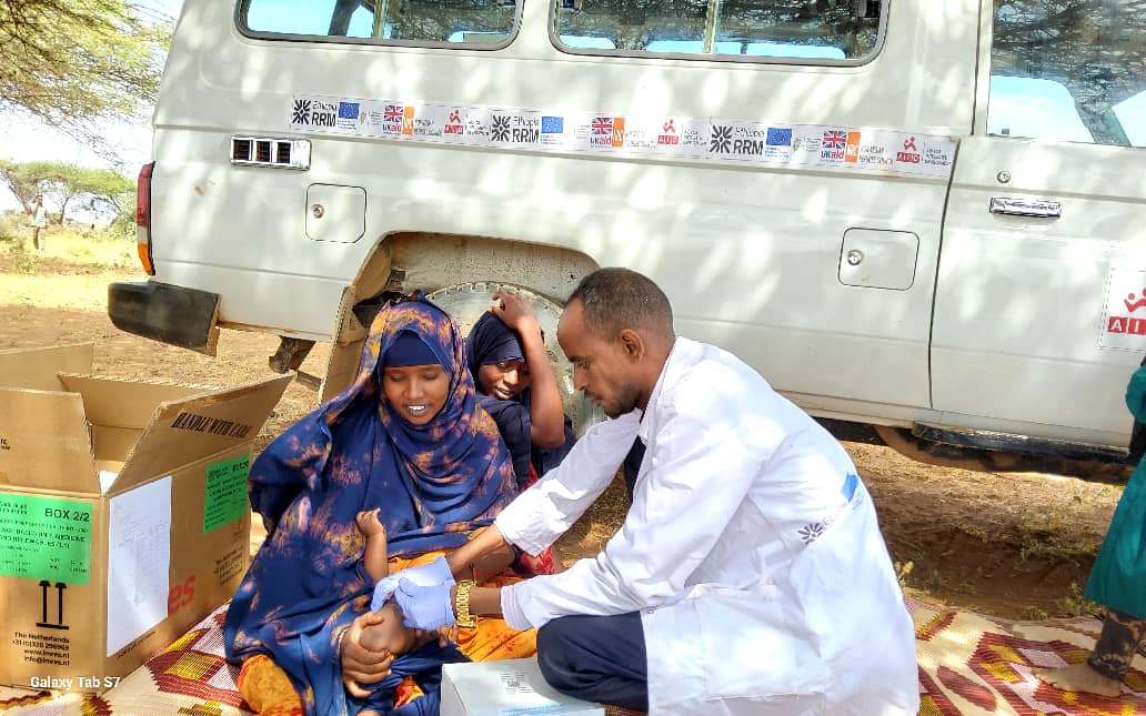 Health worker attending to a patient